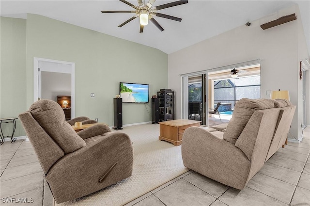 living area featuring baseboards, a sunroom, a ceiling fan, and vaulted ceiling