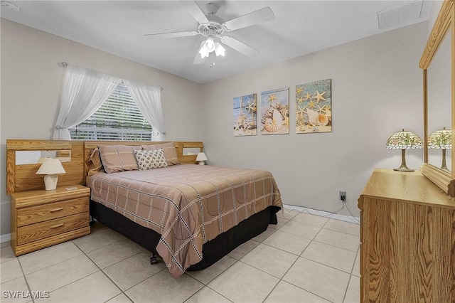 bedroom with light tile patterned floors, visible vents, and ceiling fan