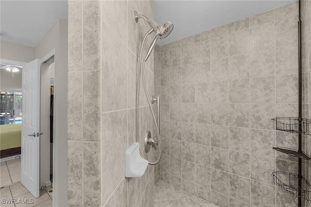 full bathroom featuring tile patterned floors, ensuite bathroom, and a tile shower