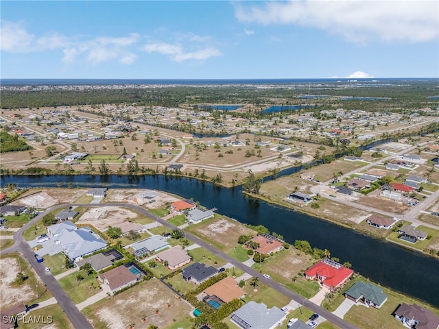 aerial view featuring a residential view and a water view