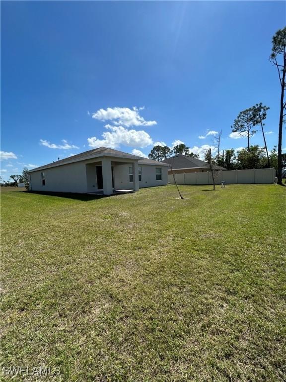 view of yard featuring fence