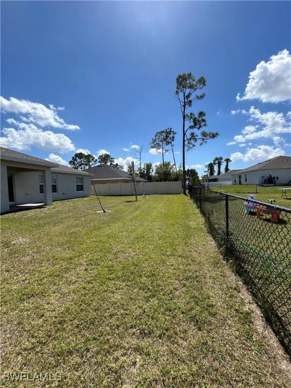 view of yard with a fenced backyard