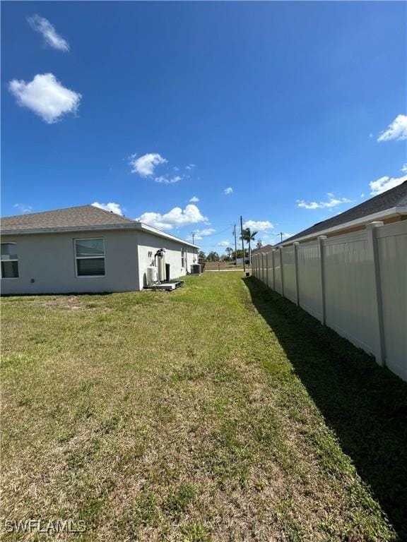 view of yard featuring fence