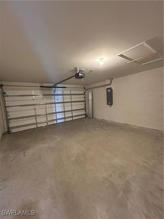 garage featuring electric panel and a garage door opener