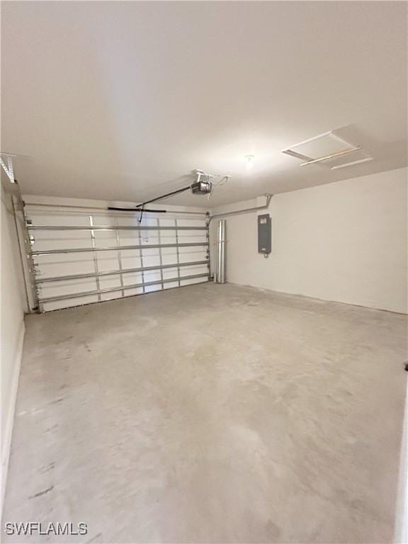 garage with electric panel and a garage door opener