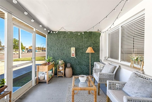 sunroom featuring track lighting