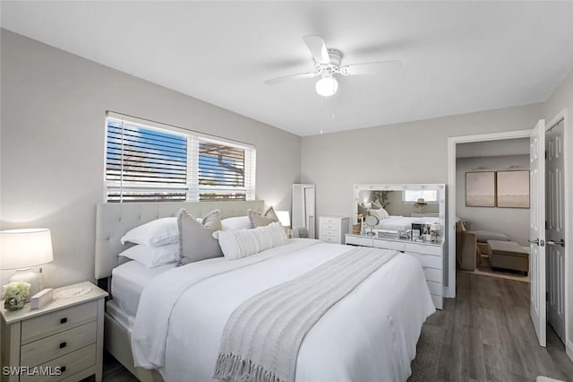 bedroom with dark wood-type flooring and a ceiling fan