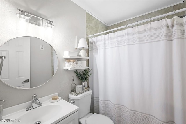 bathroom with vanity, a shower with shower curtain, and toilet