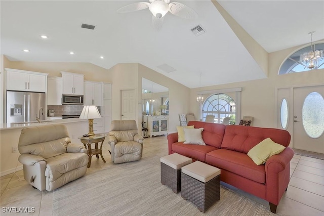 living room featuring light tile patterned floors, visible vents, recessed lighting, and vaulted ceiling