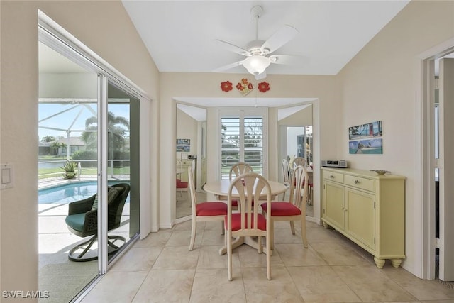 dining room featuring light tile patterned flooring, a ceiling fan, and a sunroom