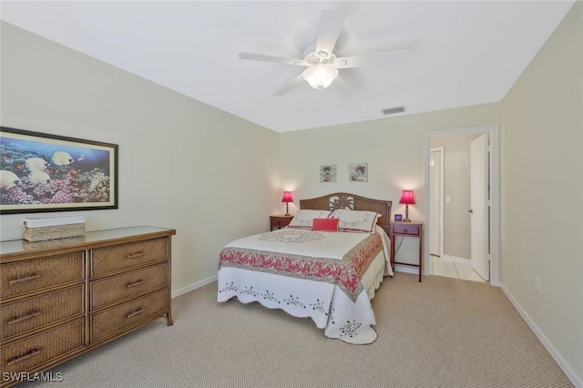 bedroom with visible vents, light carpet, baseboards, and ceiling fan