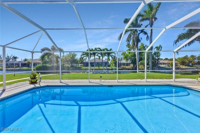 pool with glass enclosure and a lawn