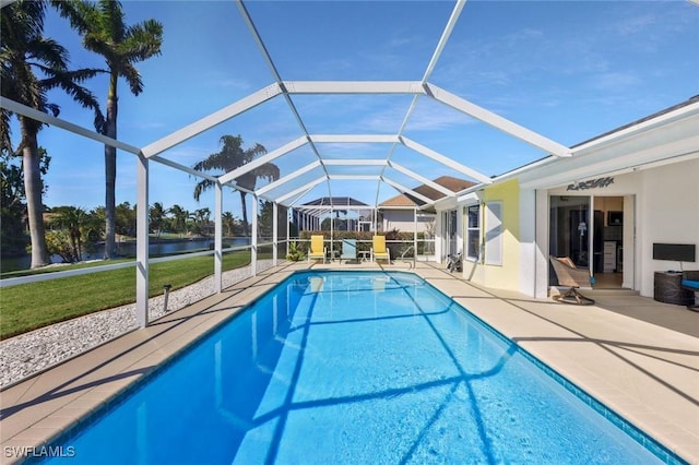 outdoor pool featuring a water view, a lanai, and a patio area