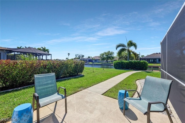 view of home's community featuring a patio area and a lawn