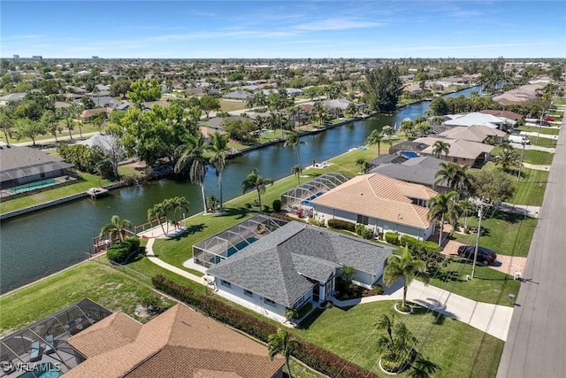 bird's eye view with a residential view and a water view