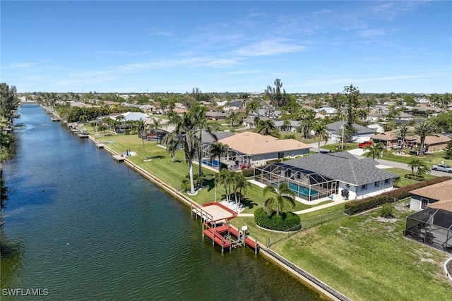 aerial view featuring a residential view and a water view