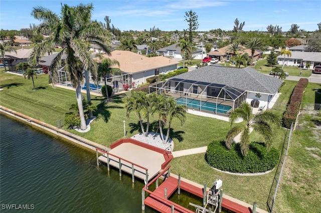 birds eye view of property with a residential view and a water view