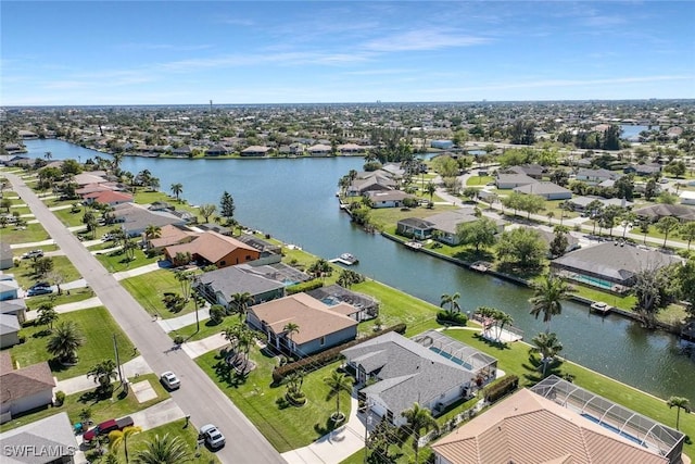 birds eye view of property featuring a residential view and a water view