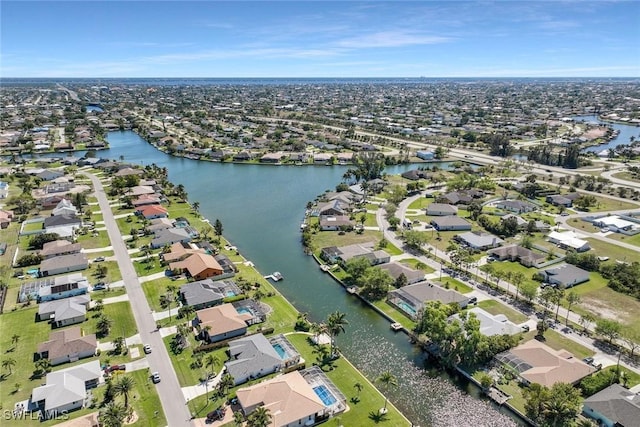 bird's eye view with a residential view and a water view