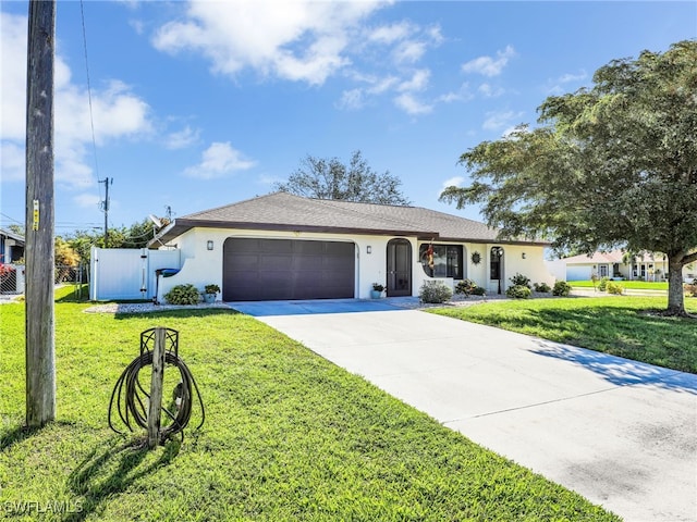 single story home featuring a front yard, stucco siding, driveway, an attached garage, and a gate