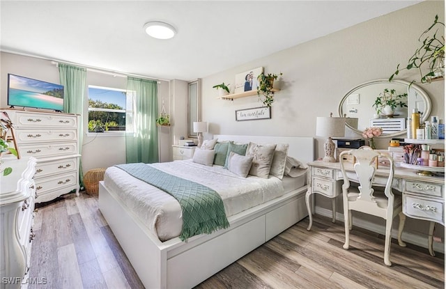 bedroom featuring wood finished floors