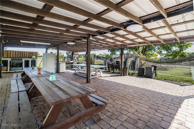 view of patio / terrace with outdoor dining space and fence