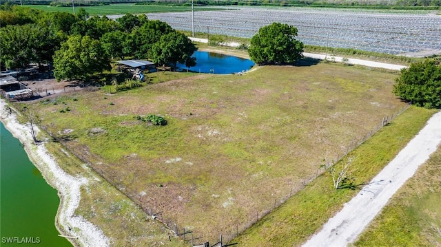 drone / aerial view with a water view and a rural view