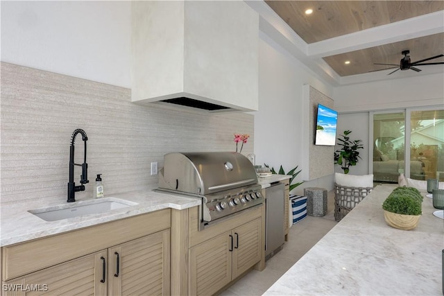 view of patio with an outdoor kitchen, area for grilling, ceiling fan, and a sink