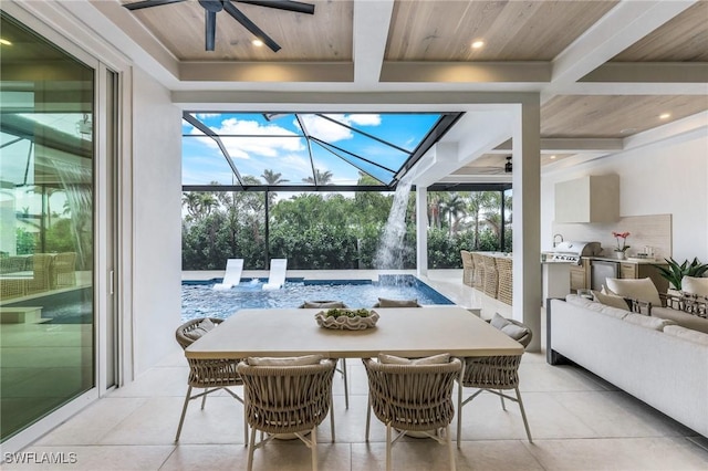 dining room featuring a ceiling fan, plenty of natural light, wood ceiling, and a sunroom