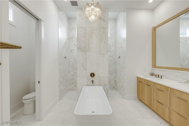 bathroom featuring visible vents, toilet, vanity, and a walk in shower