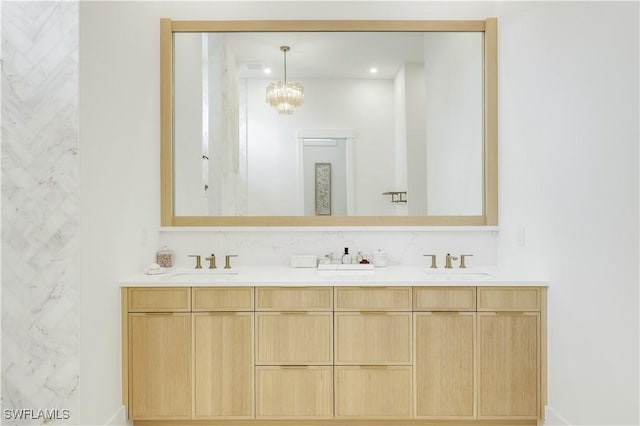 bathroom featuring a sink and double vanity