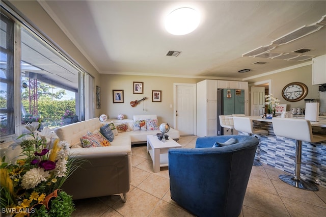 1862 Moreno Ave, Fort Myers, FL 33901 - living room with light tile patterned floors, visible vents, and ornamental molding