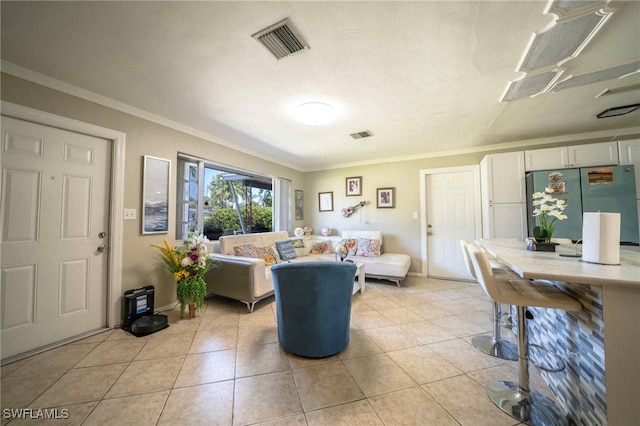 1862 Moreno Ave, Fort Myers, FL 33901 - living room featuring light tile patterned floors, visible vents, and ornamental molding