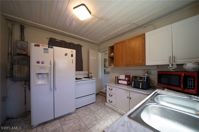 1862 Moreno Ave, Fort Myers, FL 33901 - kitchen featuring light countertops, wooden ceiling, white appliances, white cabinetry, and a sink
