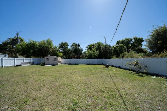1862 Moreno Ave, Fort Myers, FL 33901 - view of yard with a storage unit, an outbuilding, and a fenced backyard