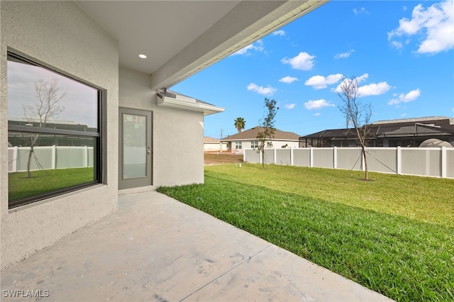 view of yard featuring a patio and fence