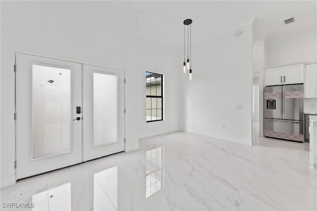 foyer entrance featuring visible vents, marble finish floor, baseboards, and ornamental molding