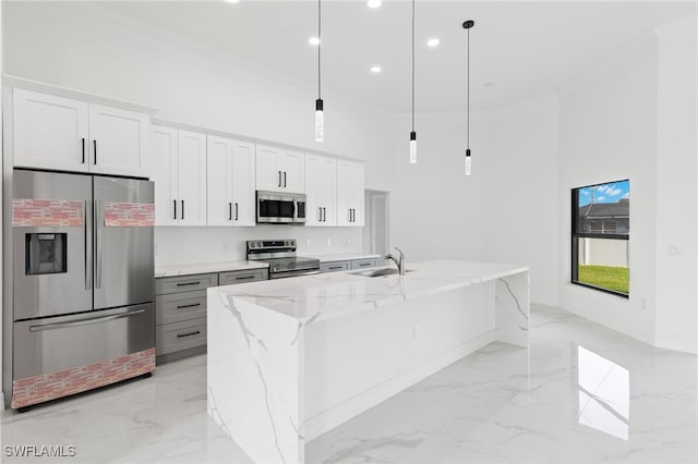 kitchen featuring a sink, crown molding, marble finish floor, and stainless steel appliances