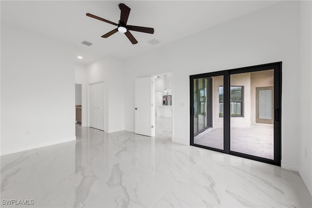 spare room with baseboards, visible vents, and marble finish floor