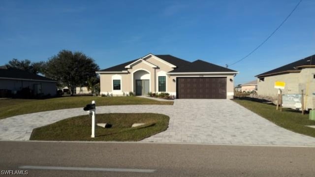 ranch-style house featuring a garage, curved driveway, and a front lawn