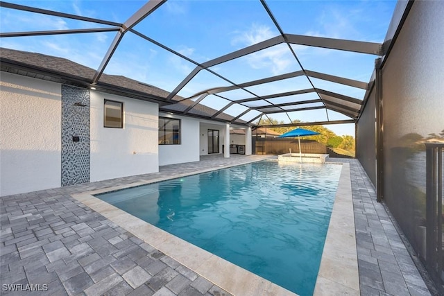 pool with a lanai and a patio