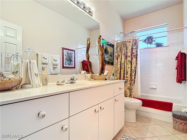 2030 Rio Nuevo Dr, North Fort Myers, FL 33917 - bathroom featuring vanity, tile patterned flooring, toilet, and shower / bath combo with shower curtain