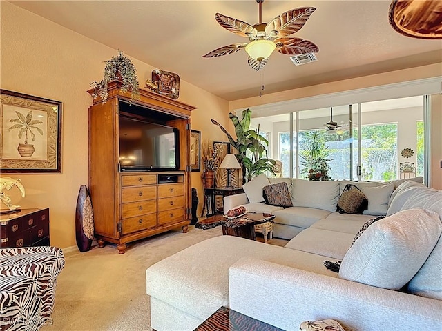 2030 Rio Nuevo Dr, North Fort Myers, FL 33917 - living room with ceiling fan and light carpet