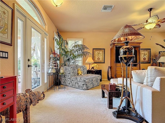 2030 Rio Nuevo Dr, North Fort Myers, FL 33917 - carpeted living area featuring ceiling fan and a textured ceiling