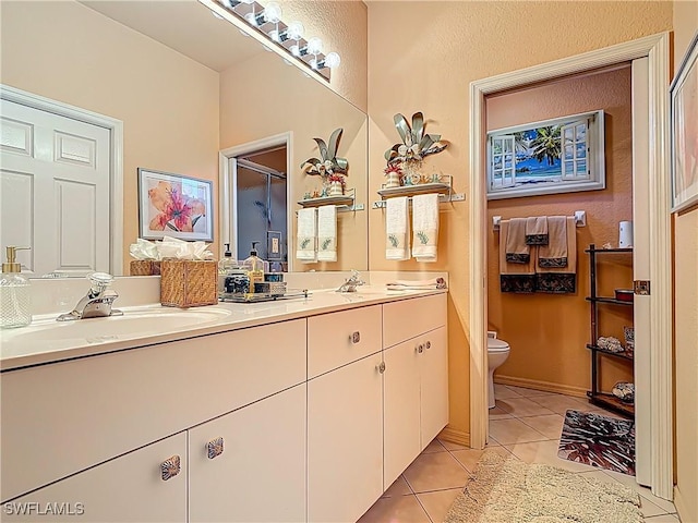 2030 Rio Nuevo Dr, North Fort Myers, FL 33917 - full bathroom featuring toilet, double vanity, and tile patterned flooring