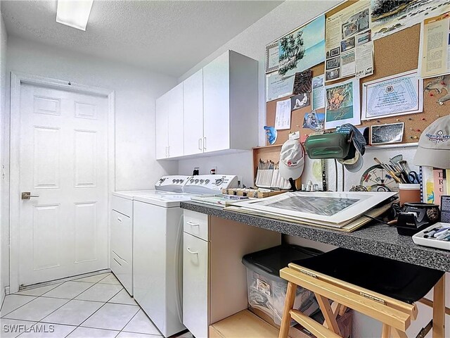 2030 Rio Nuevo Dr, North Fort Myers, FL 33917 - kitchen featuring white cabinetry, washer and clothes dryer, light tile patterned floors, and a textured ceiling