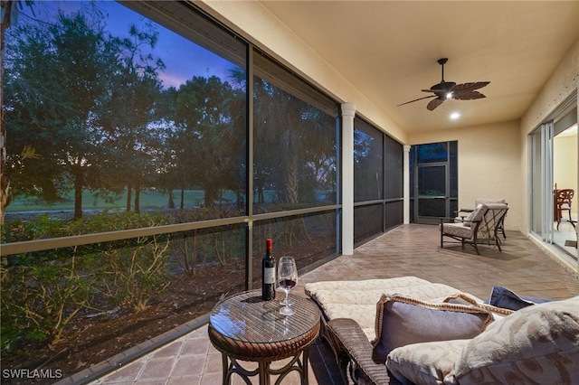 sunroom / solarium with ceiling fan