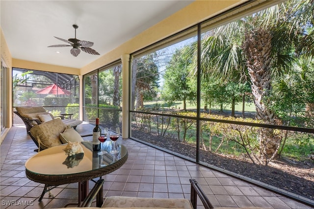 sunroom with a ceiling fan