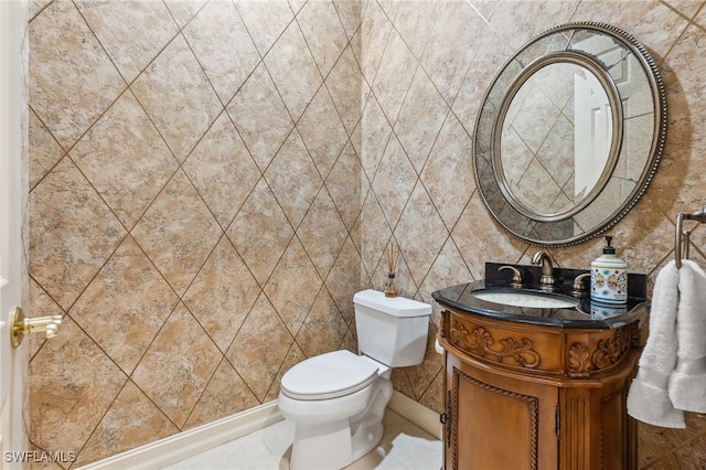 bathroom featuring toilet and vanity