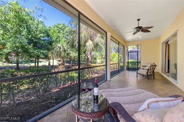 sunroom / solarium with ceiling fan